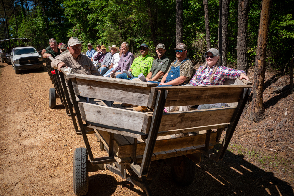 A large group of people in a wagon.