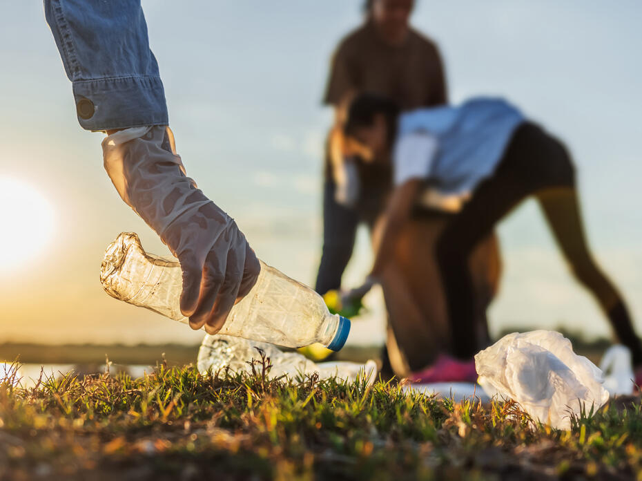 Person picking up trash.