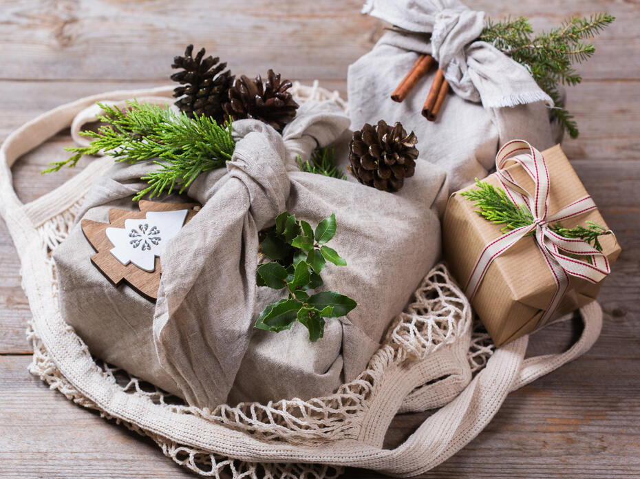 gifts wrapped in fabric scraps, recycled paper, raffia, and homemade embelishments