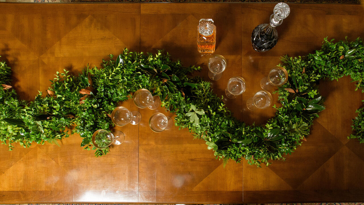 Green garland on a table.