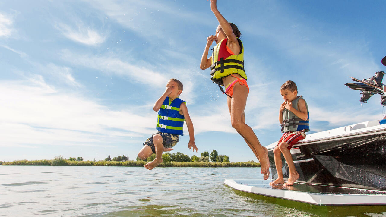 Kids jumping in a lake