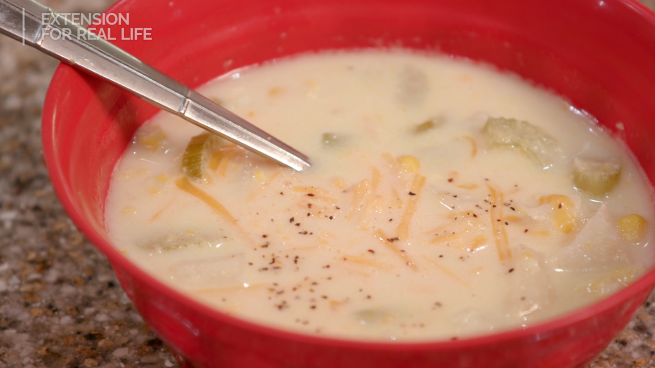 A bowl of potato corn chowder.