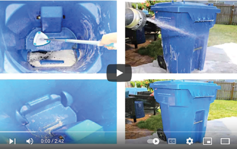 Screen capture from a video of a person cleaning a large garbage can.
